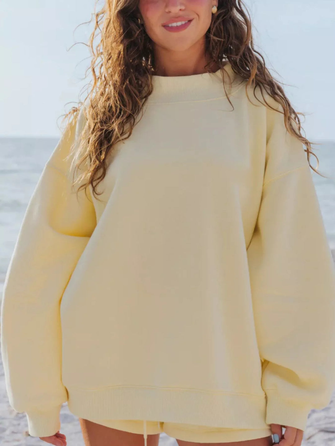 Butter yellow oversized sweatshirt, front view with relaxed sleeves