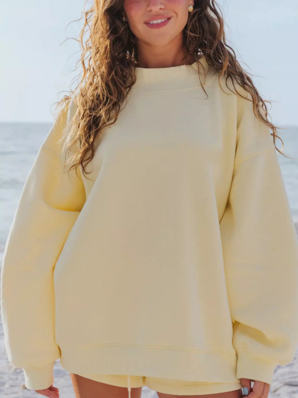 Butter yellow oversized sweatshirt, front view with relaxed sleeves