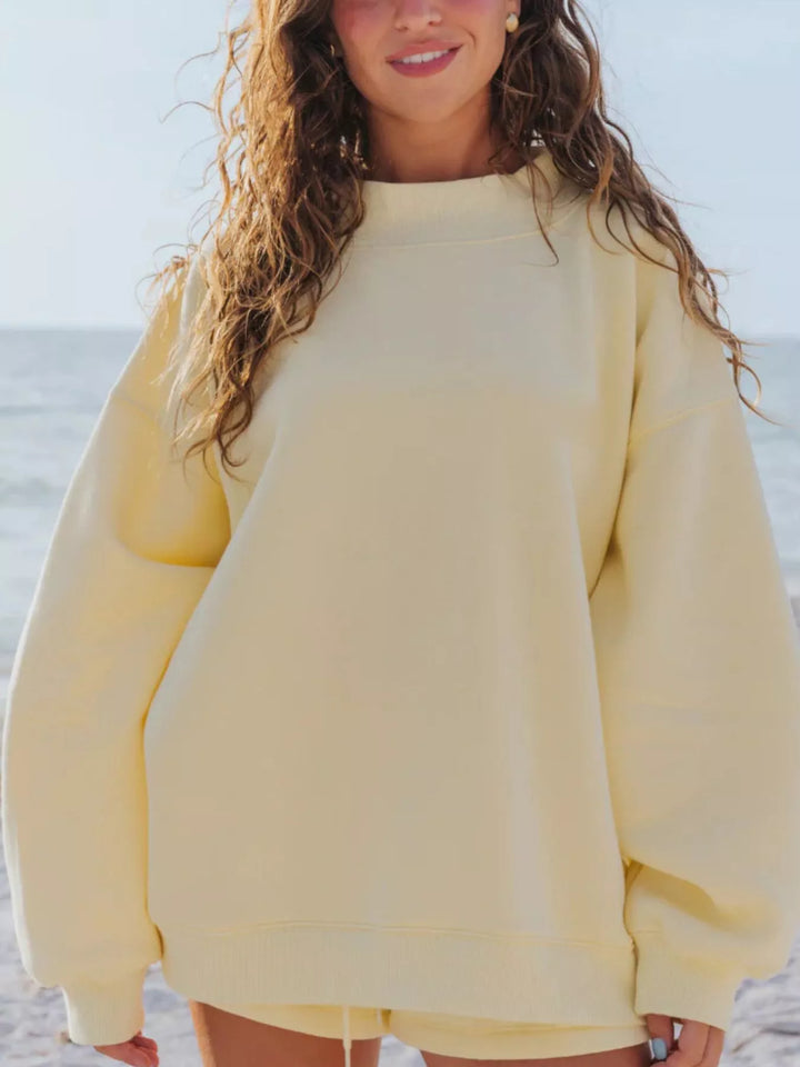 Butter yellow oversized sweatshirt, front view with relaxed sleeves