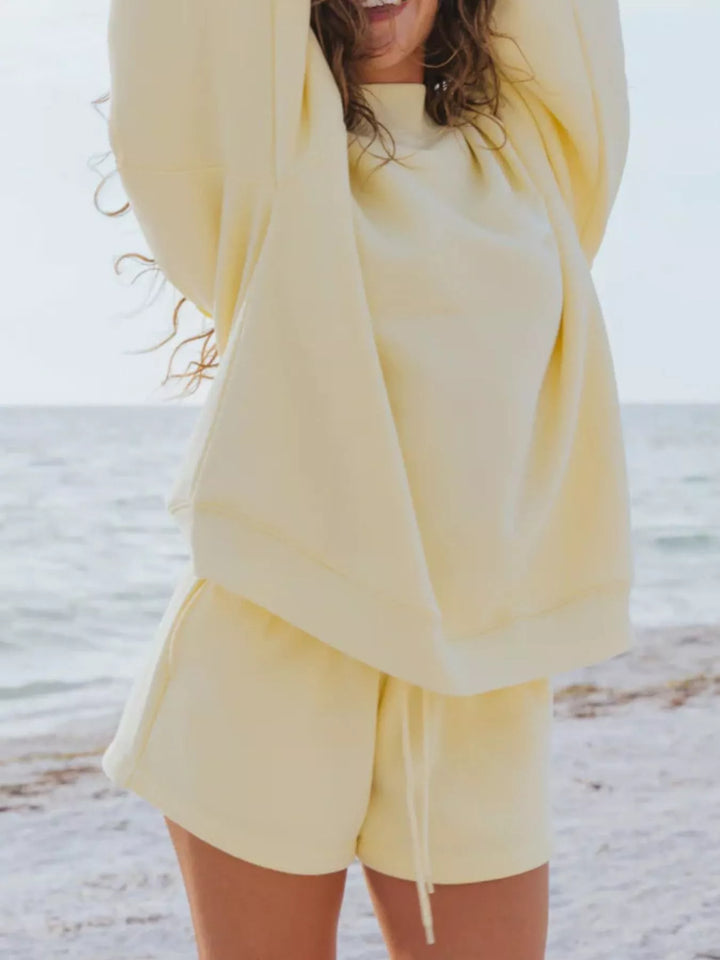 Butter yellow shorts set with sweatshirt lifted, showing the drawstring shorts