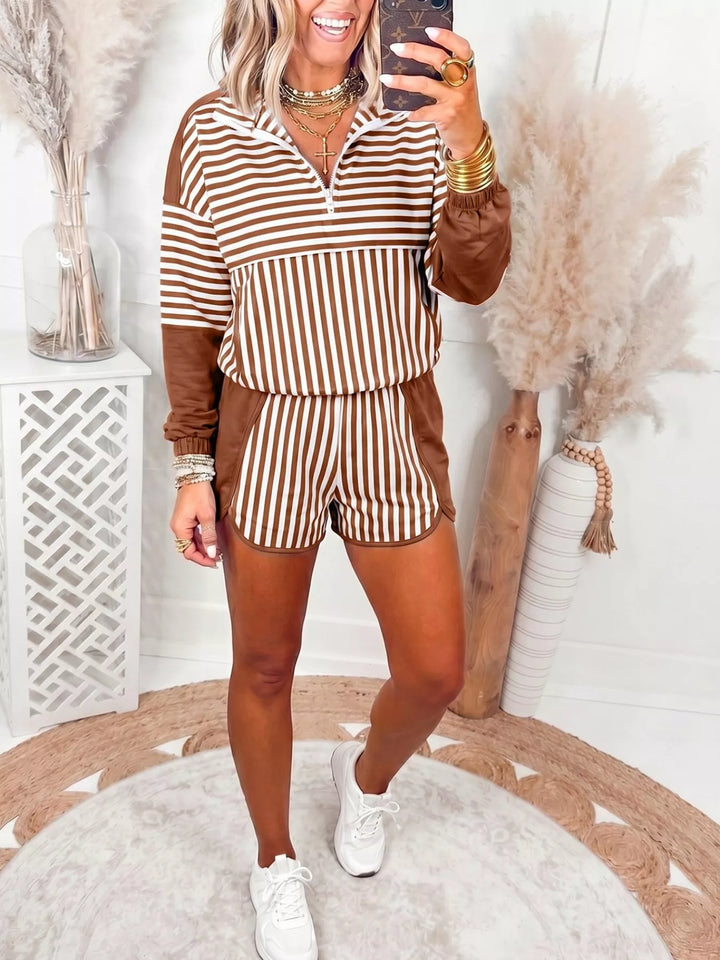 Brown striped quarter zip pullover and shorts set, full length with white sneakers