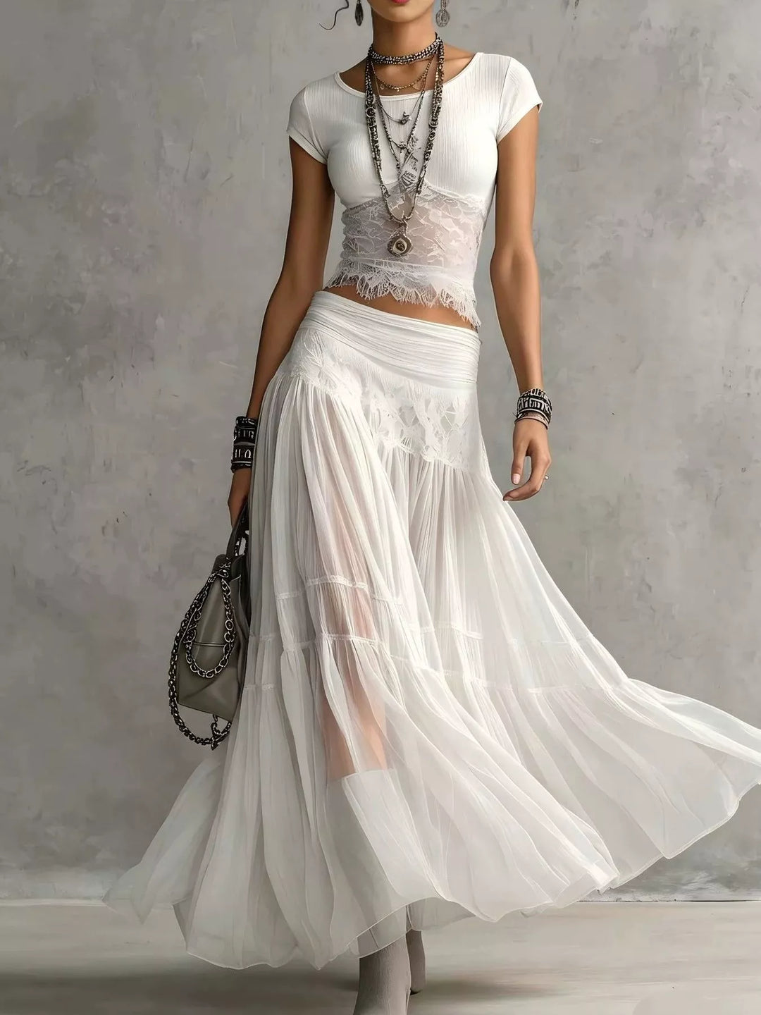 White lace top and tiered sheer maxi skirt set, full-length walking pose