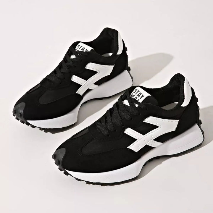 Women's sneakers in black, chunky platform lace up with mesh panels and white accent
