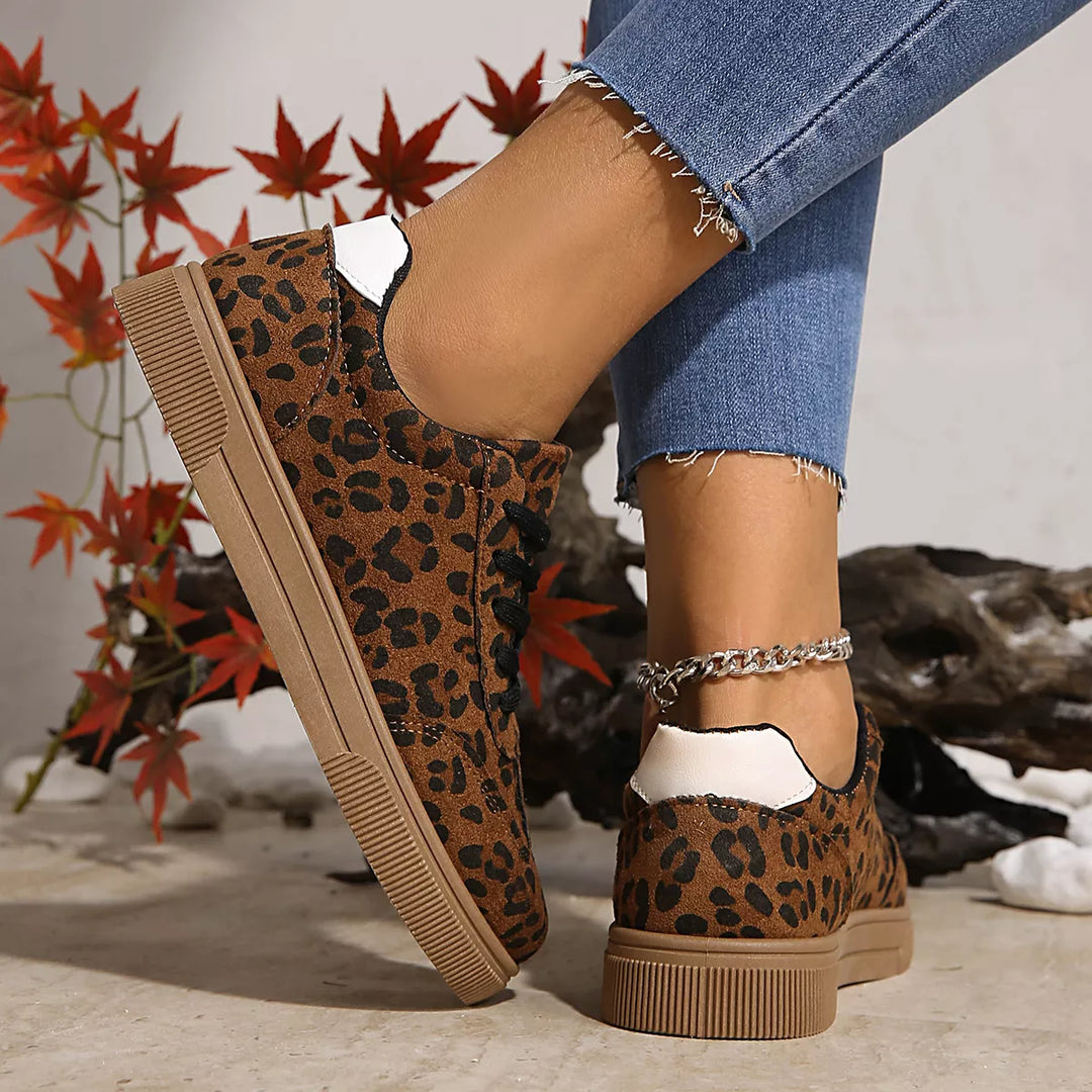 Heel view of the leopard sneakers with white heel tab and flat sole