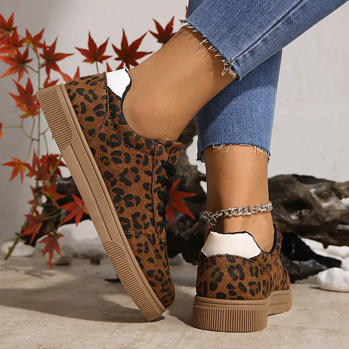 Heel view of the leopard sneakers with white heel tab and flat sole