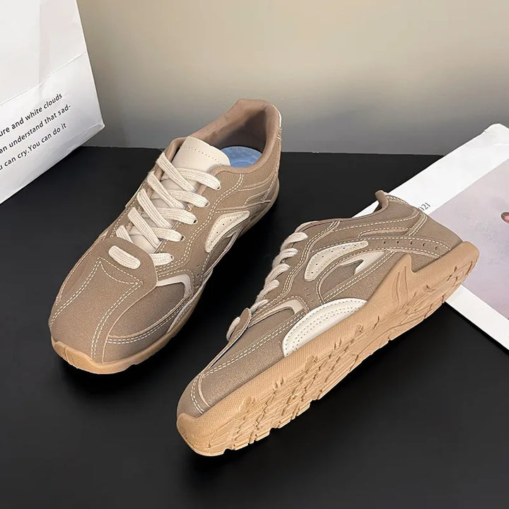 Pair of camel sneakers with cream contrast panels, top and side angles