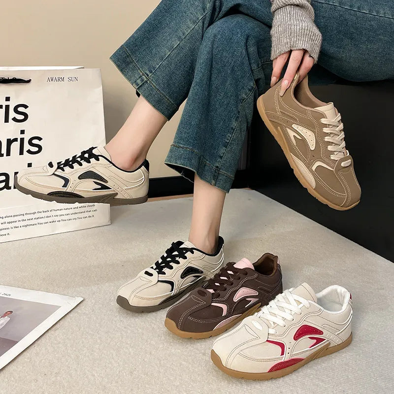 Women's sneakers with retro lace up and contrast panels in four colorways, worn with jeans