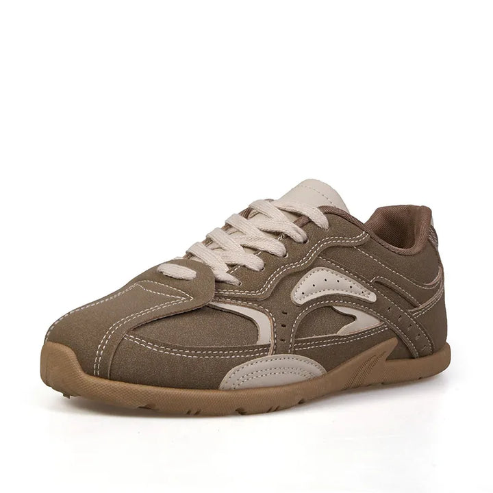 Single brown retro sneaker with cream laces and panels on a white background
