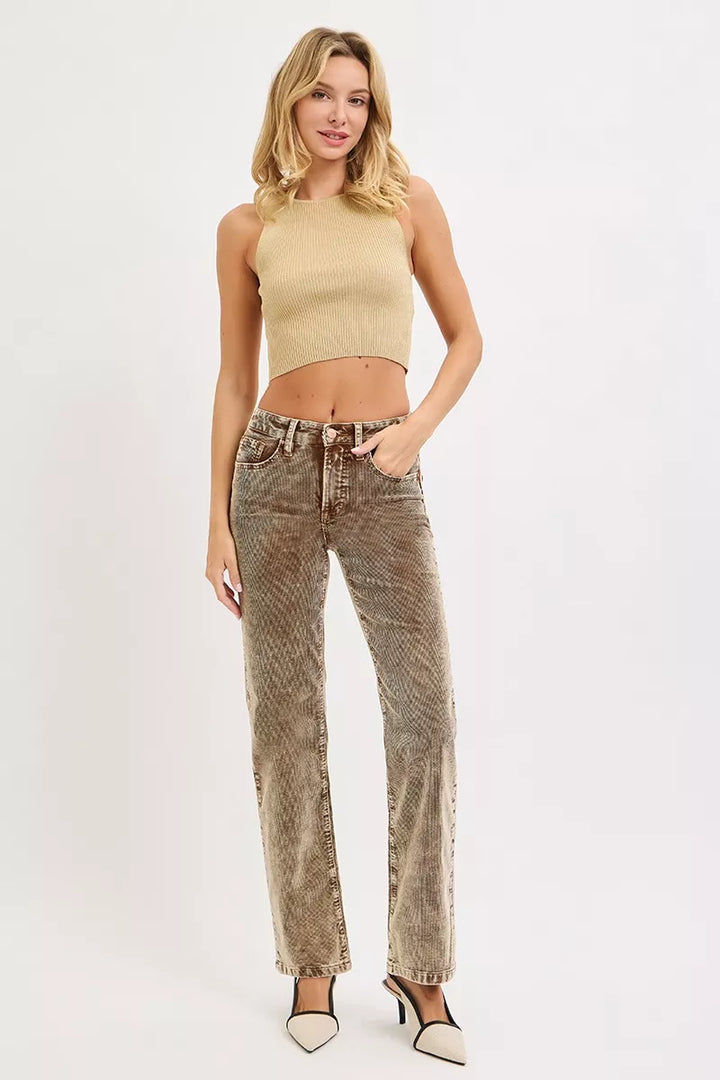 Mocha straight leg pants styled with a cream halter crop top and heels