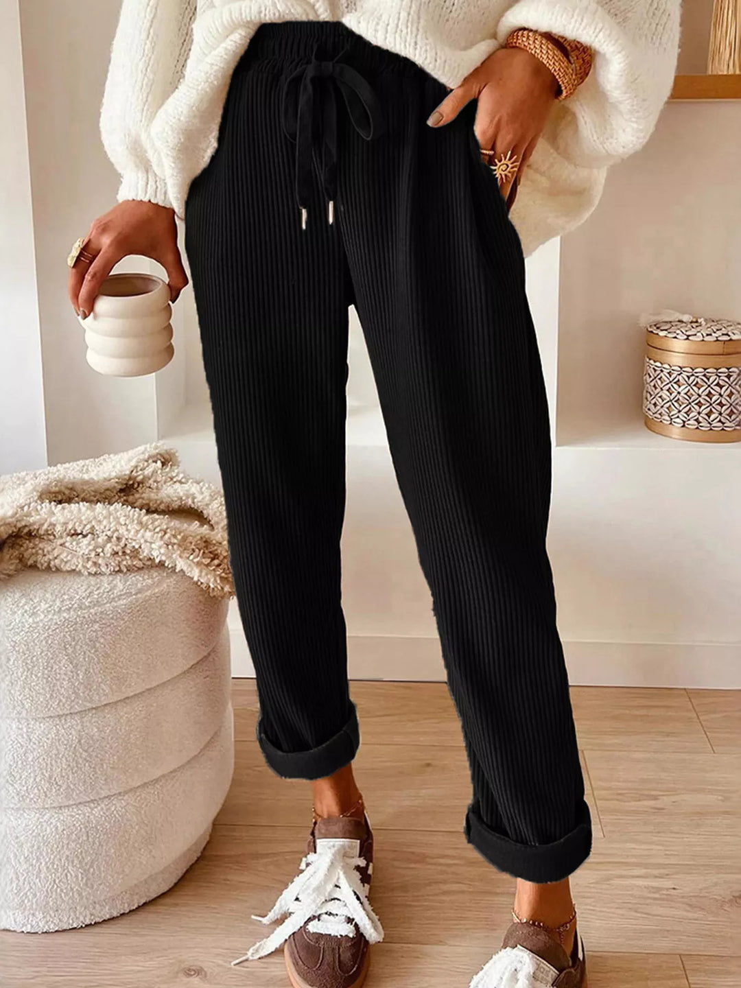 Black ribbed straight leg pants with drawstring waist, full length front view