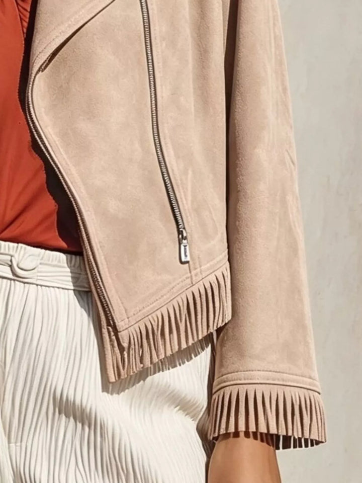 Cropped moto fringe hem asymmetric zip in apricot, close-up detail