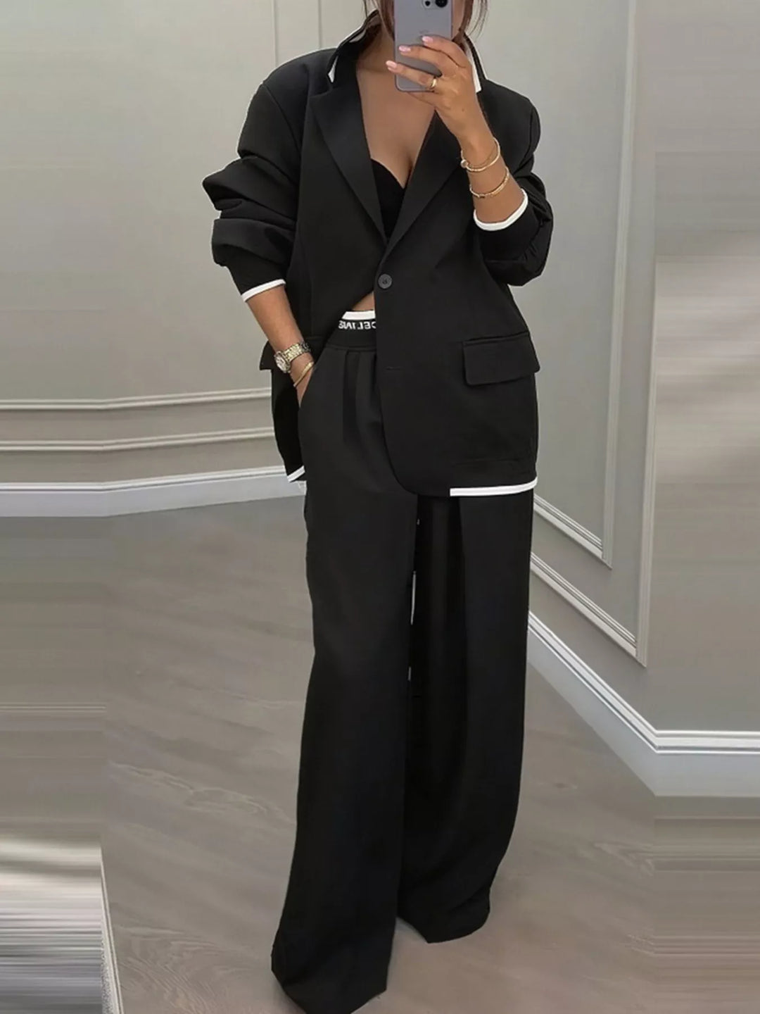 Oversized one button blazer and wide leg pants in black, front view