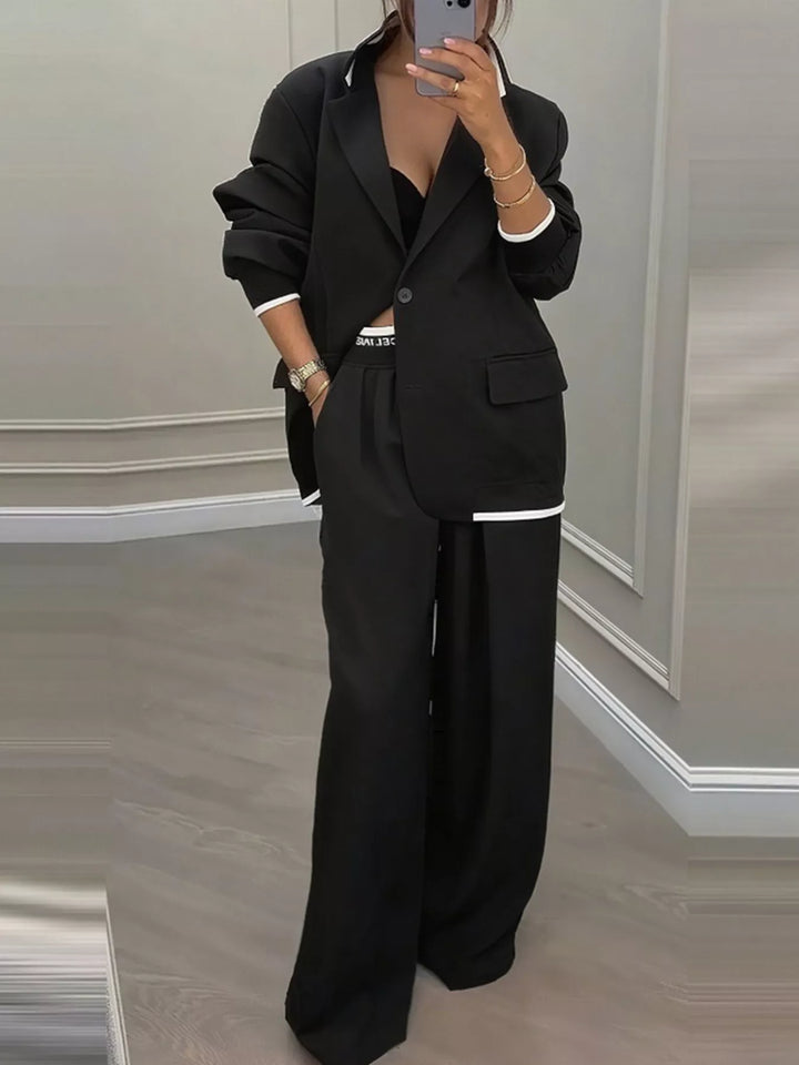 Oversized one button blazer and wide leg pants in black, front view