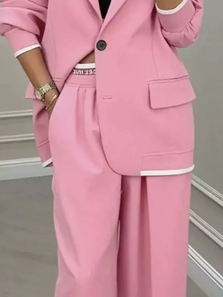 Oversized one button blazer and wide leg pants in pink, close-up detail