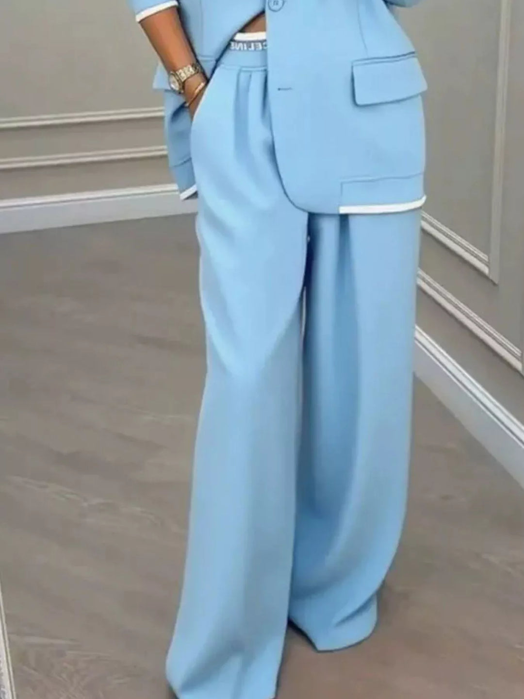 Oversized one button blazer and wide leg pants in sky blue, close-up detail