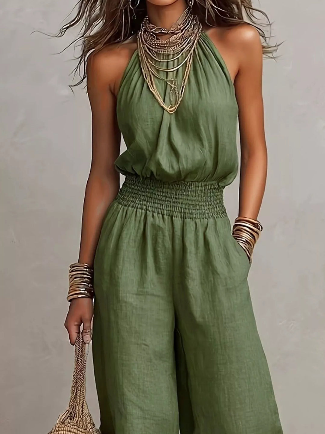 Olive summer jumpsuit, closer look at the smocked waist and halter neckline
