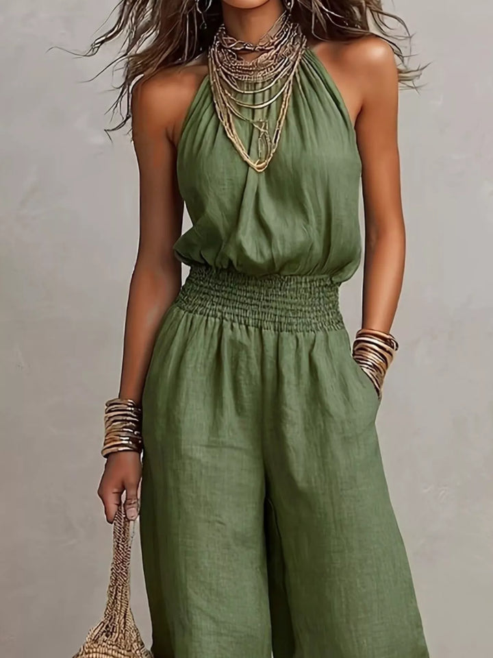 Olive summer jumpsuit, closer look at the smocked waist and halter neckline