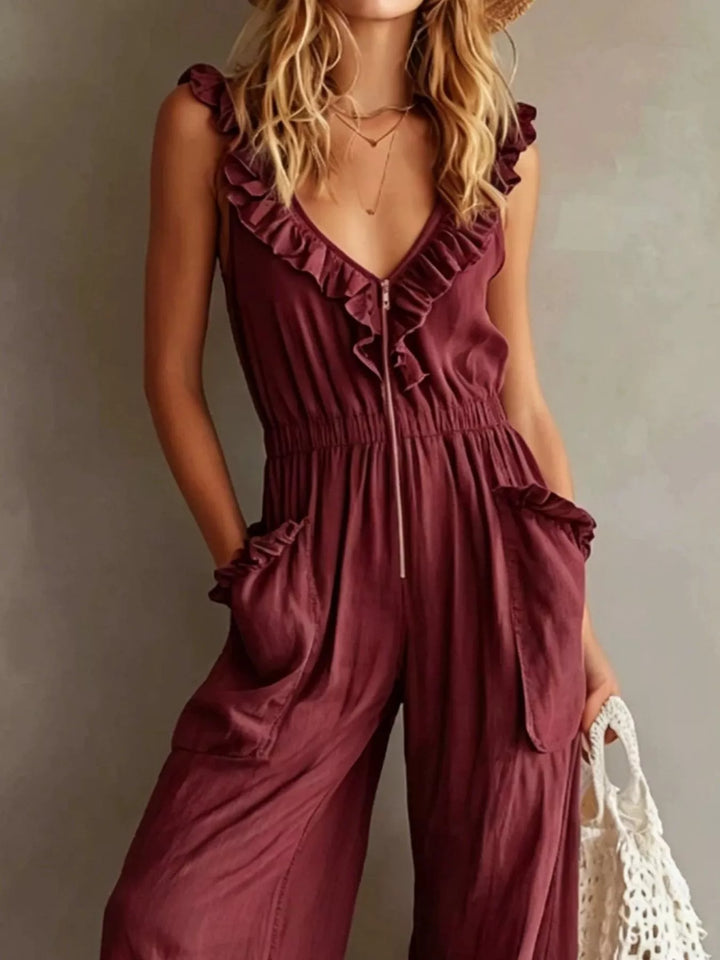 Burgundy jumpsuit close up of the ruffled neckline and waist
