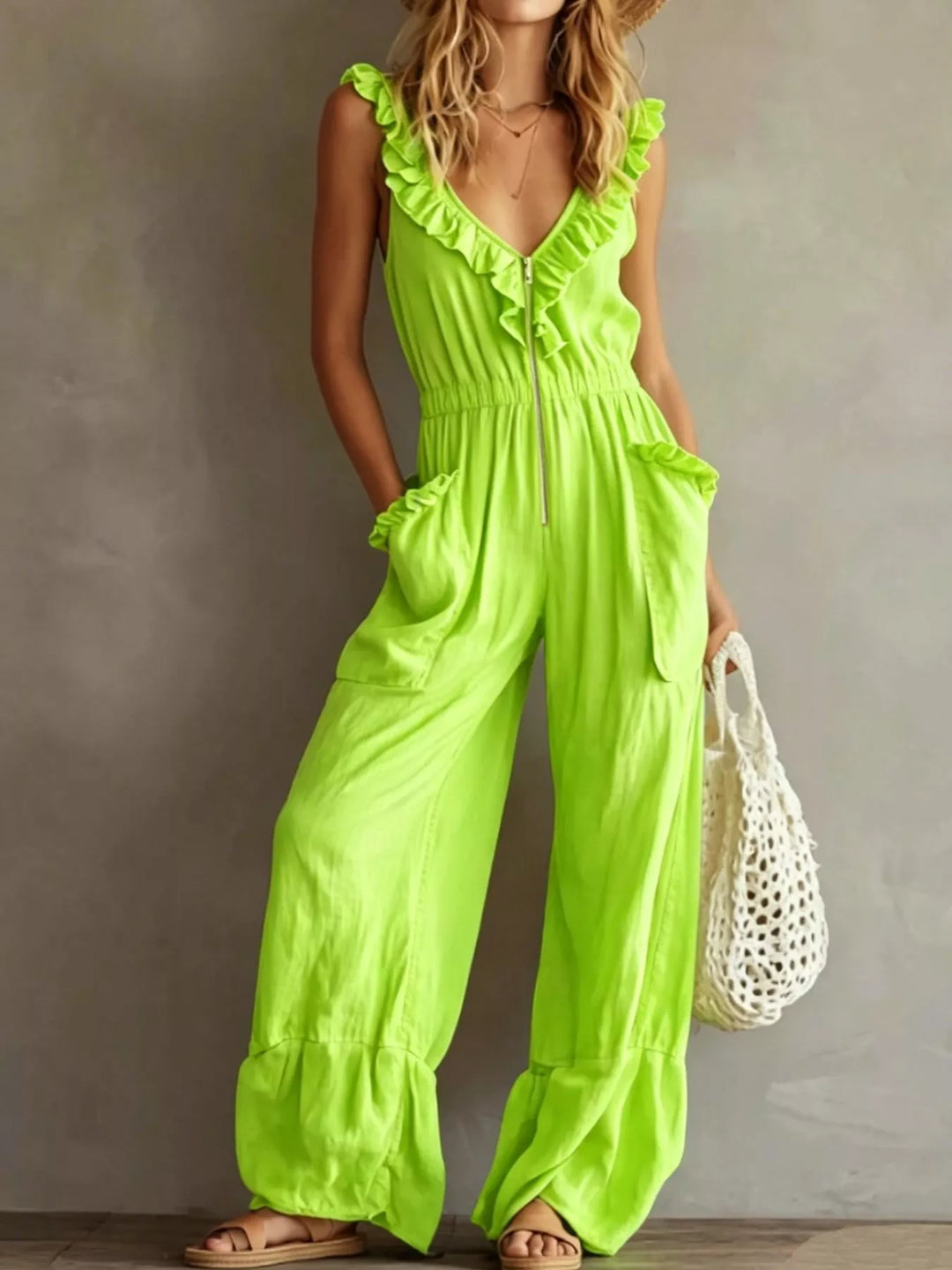 Neon green wide leg jumpsuit with ruffle V neck, standing pose
