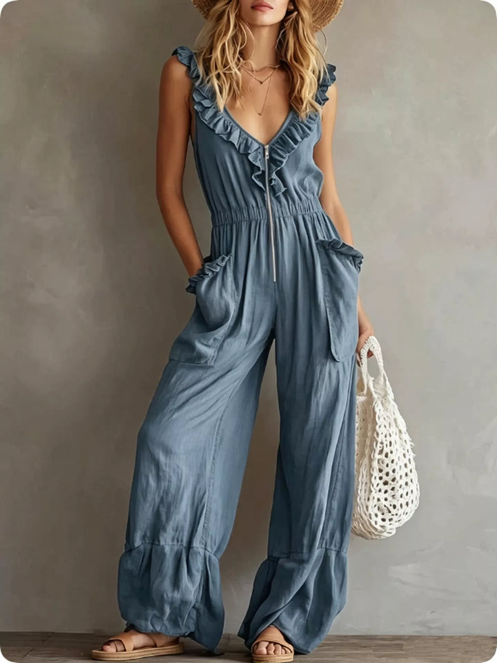 Steel blue sleeveless wide leg jumpsuit with ruffled neckline, front view