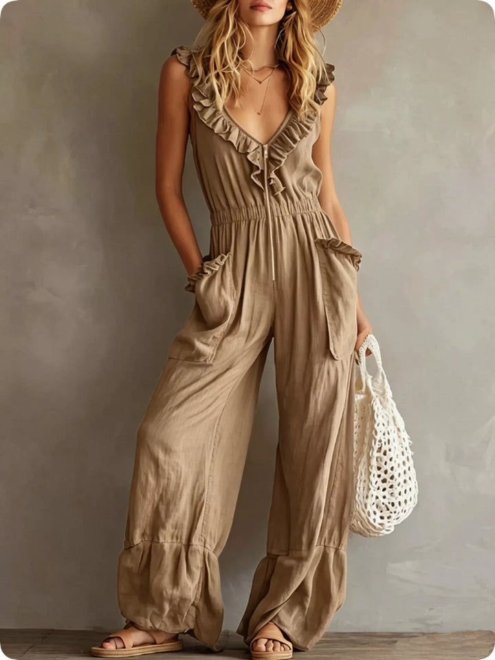 Tan sleeveless jumpsuit with wide legs and ruffle V neck, front view