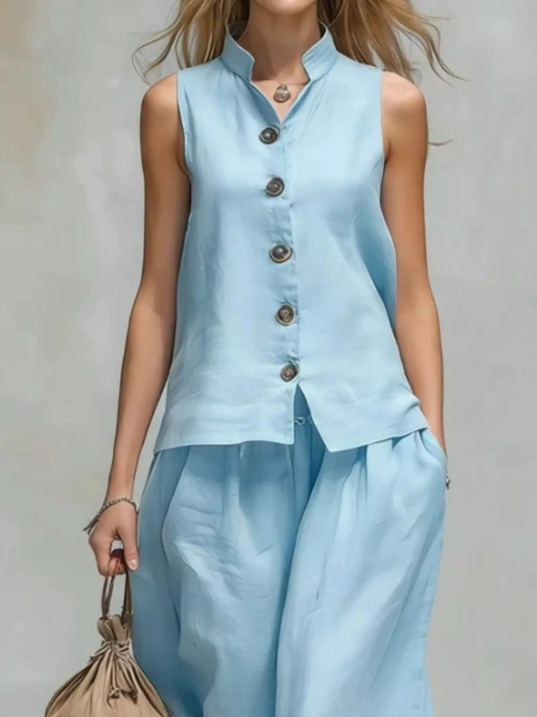 Light blue button front vest with stand collar, front view with pants