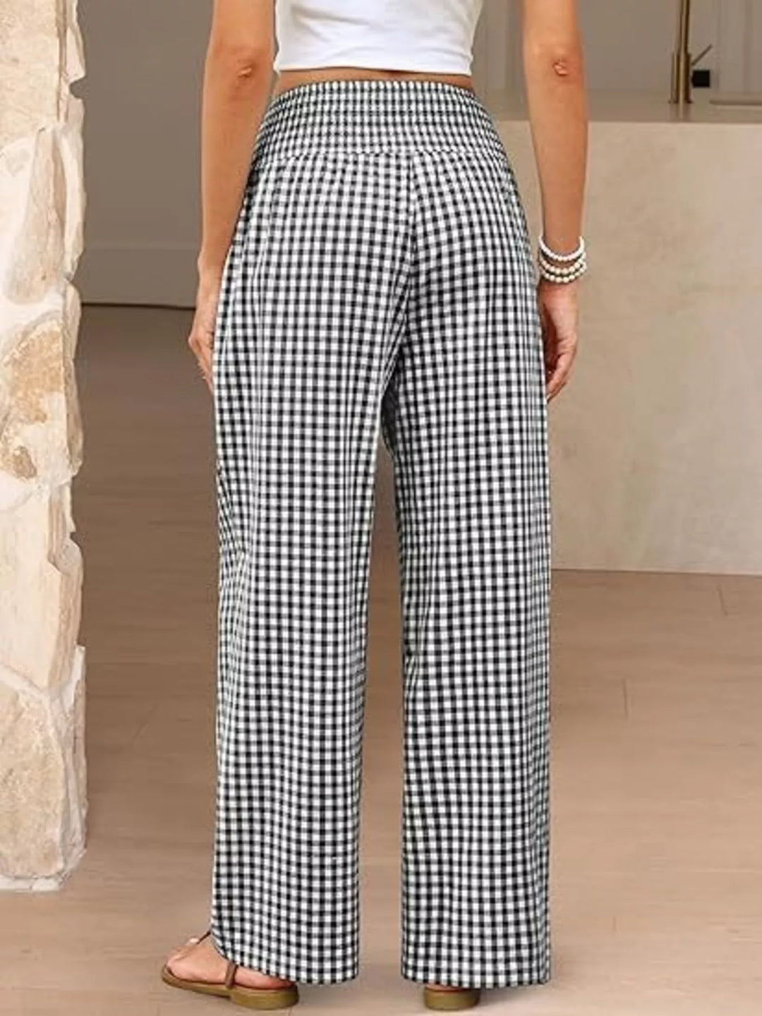 Back view of the black gingham wide leg pants with smocked waistband