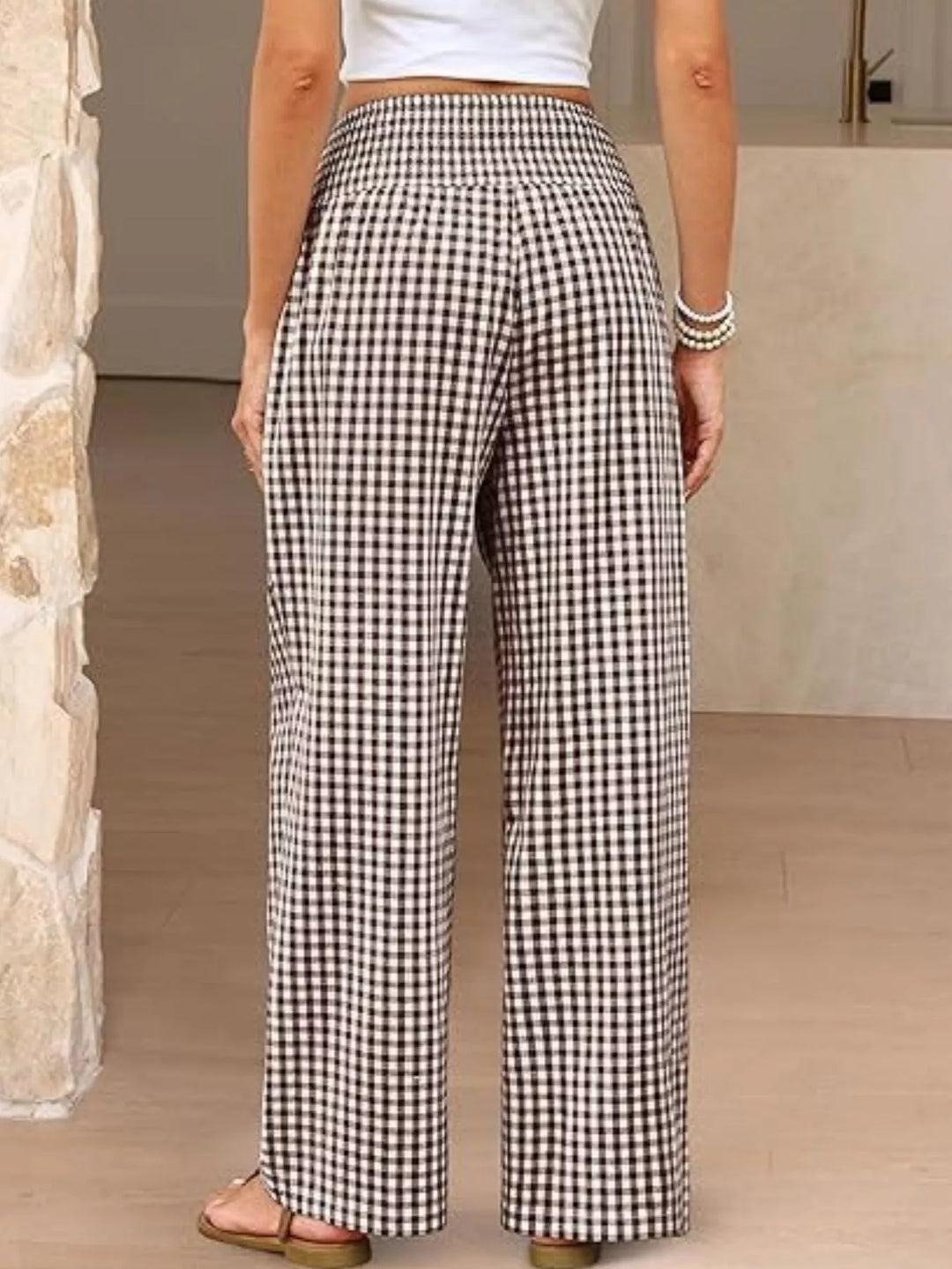 Back view of the brown gingham wide leg pants with smocked waistband
