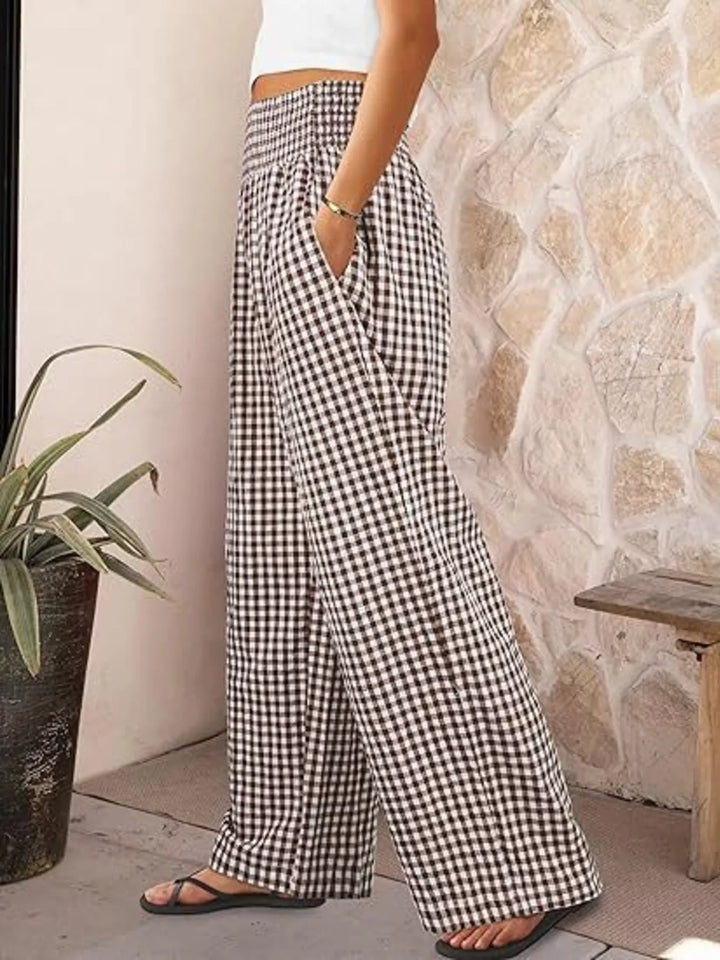 Brown gingham summer pants in side view with sandals