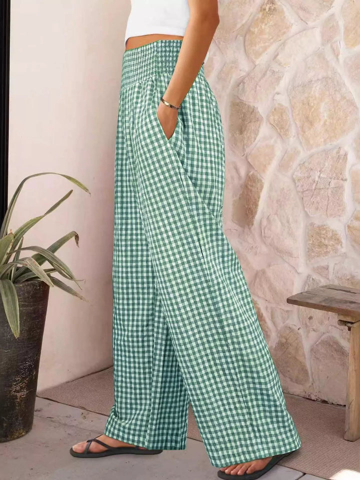 Mint gingham wide leg pants in side view with hand in pocket