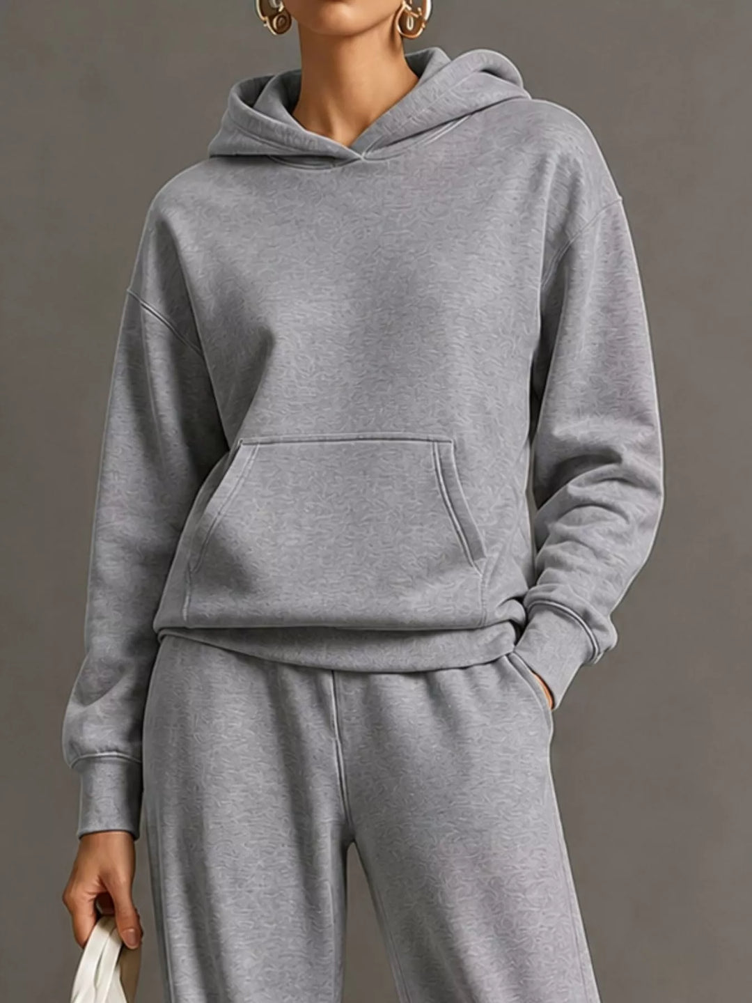 Kangaroo pocket hoodie and wide leg pants in gray, close-up detail