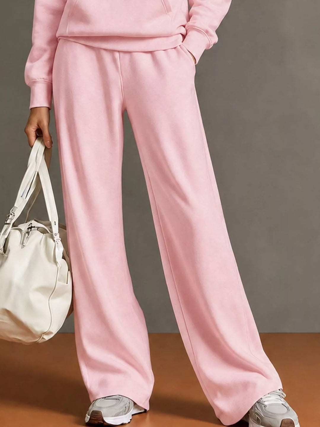 Kangaroo pocket hoodie and wide leg pants in pink, close-up detail 2