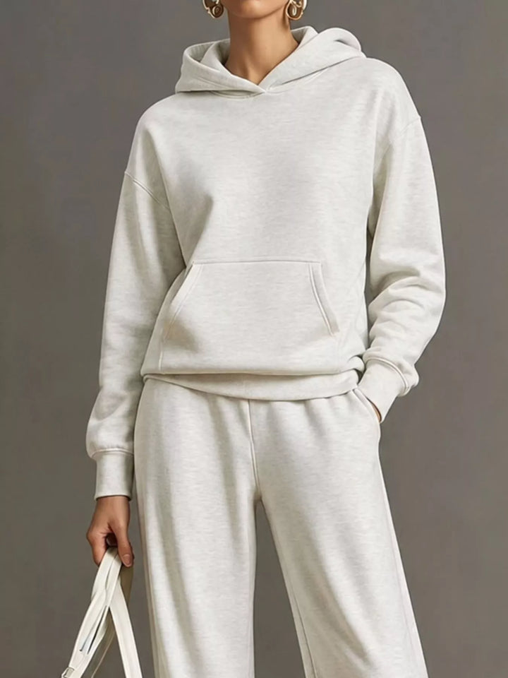 Kangaroo pocket hoodie and wide leg pants in white, close-up detail