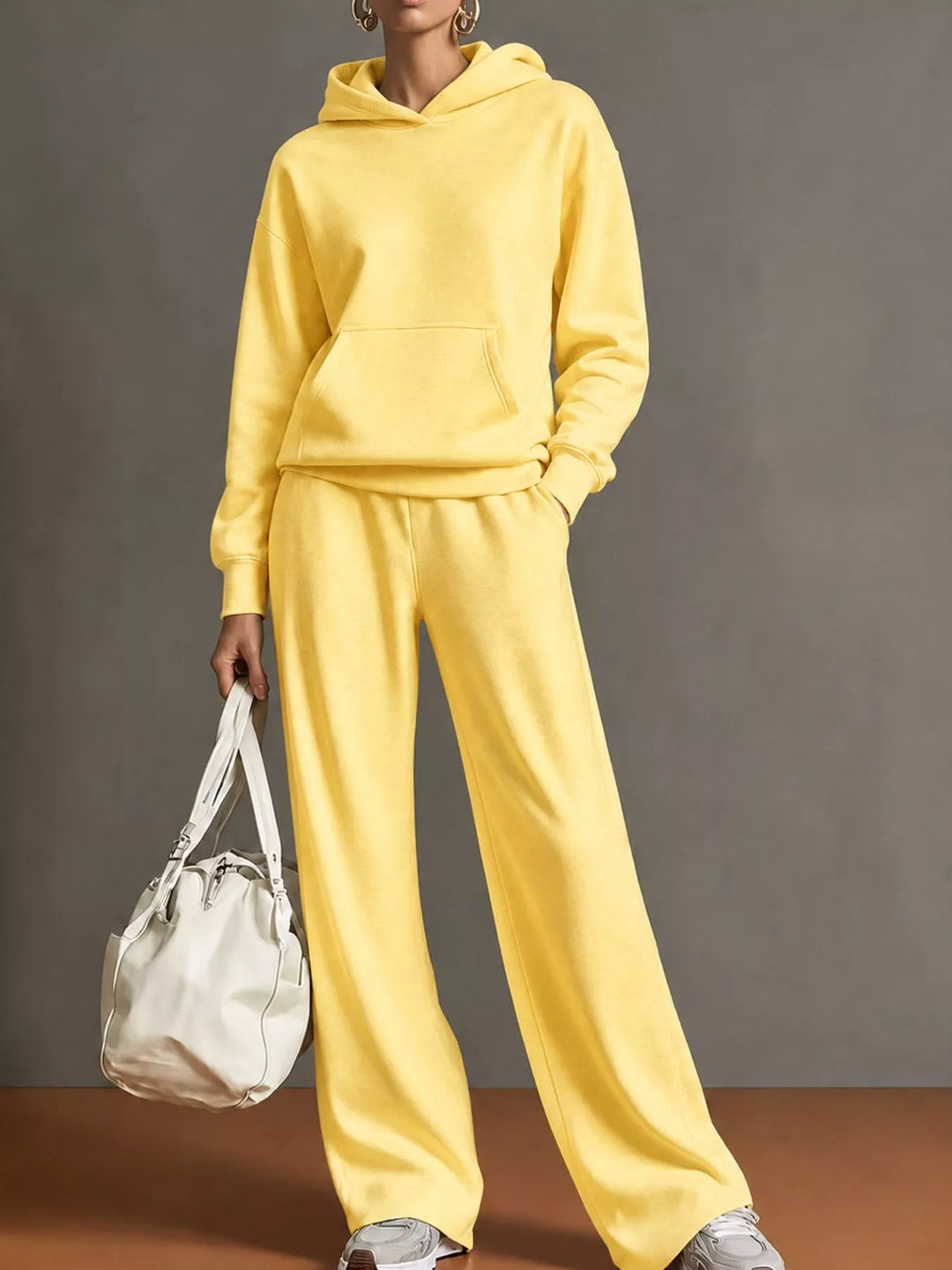 Kangaroo pocket hoodie and wide leg pants in yellow, front view