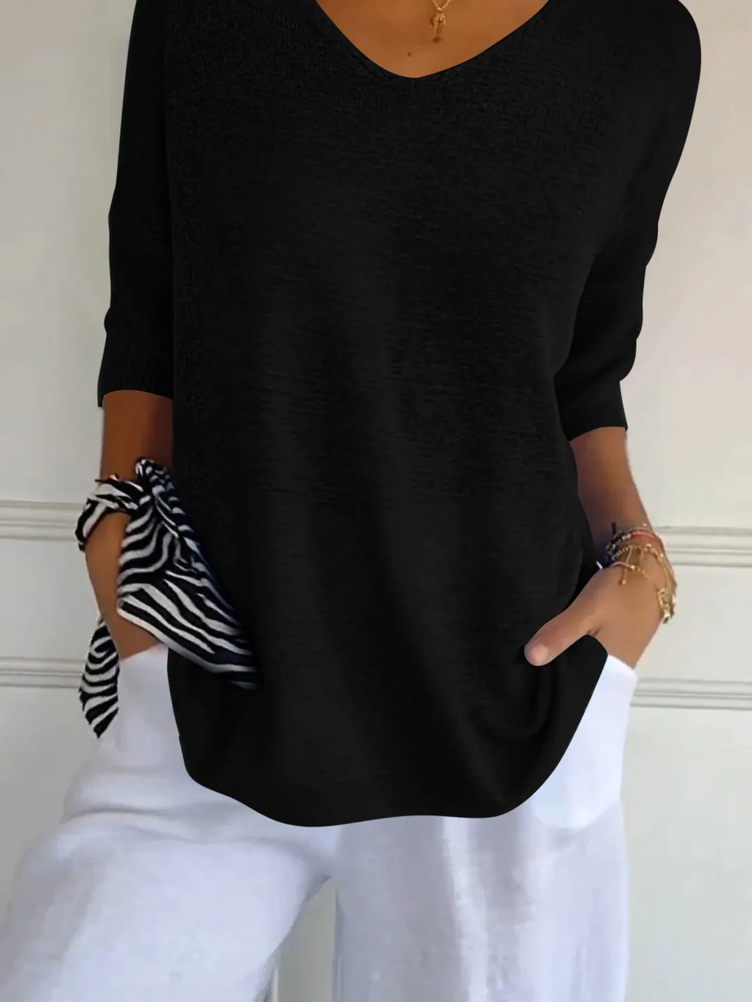 Black lightweight V neck sweater with 3/4 sleeves and a zebra print scarf