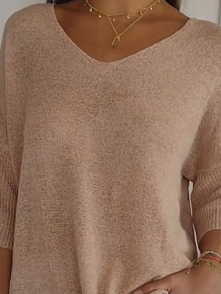 Camel lightweight sweater close-up of the V neckline and layered necklaces