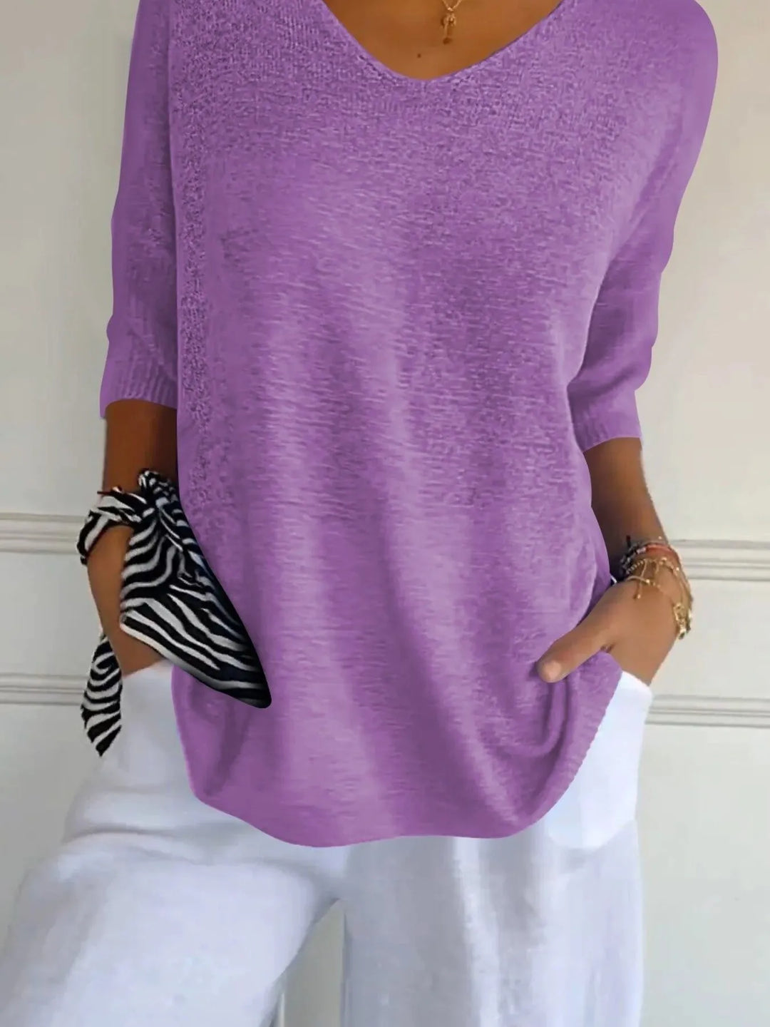 Lilac lightweight sweater detail of the 3/4 sleeve and relaxed hem