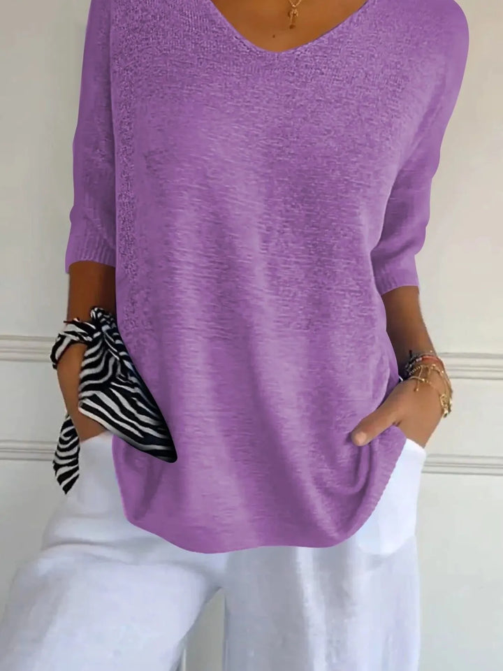 Lilac lightweight sweater detail of the 3/4 sleeve and relaxed hem
