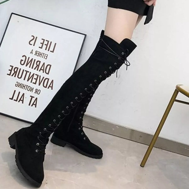 Black thigh high boots with side zipper and lace up front