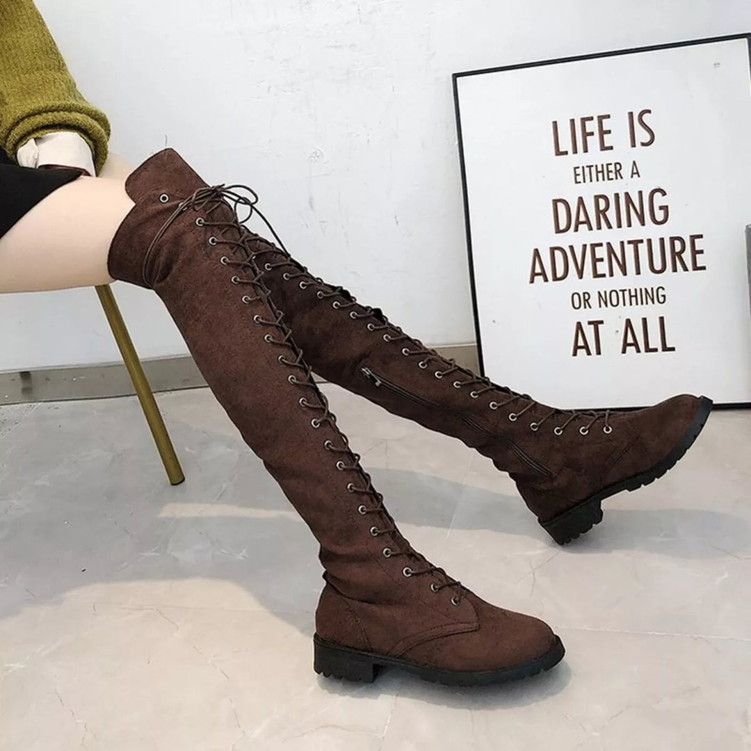 Side view of dark brown over the knee boots with block heel