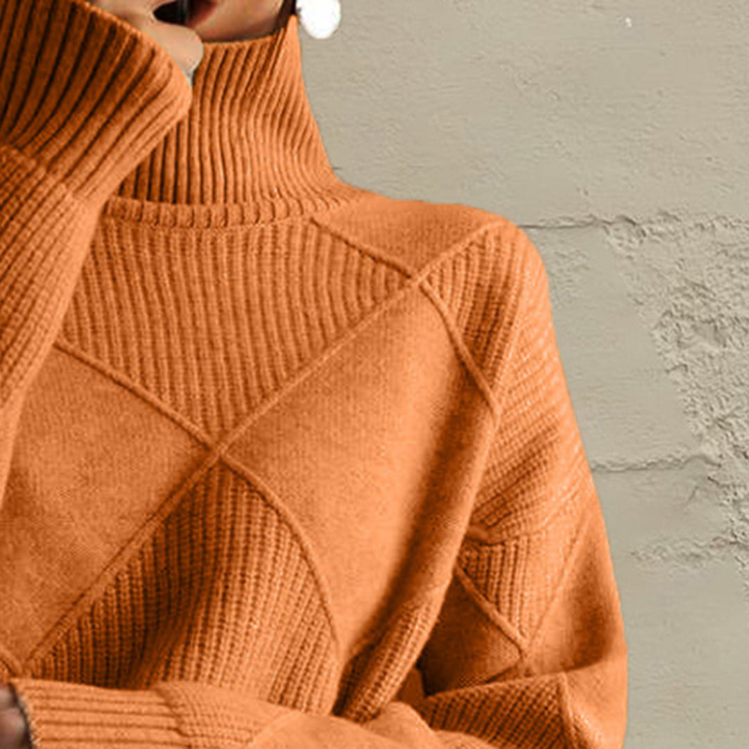 Close-up of the burnt orange turtleneck collar and diamond knit pattern