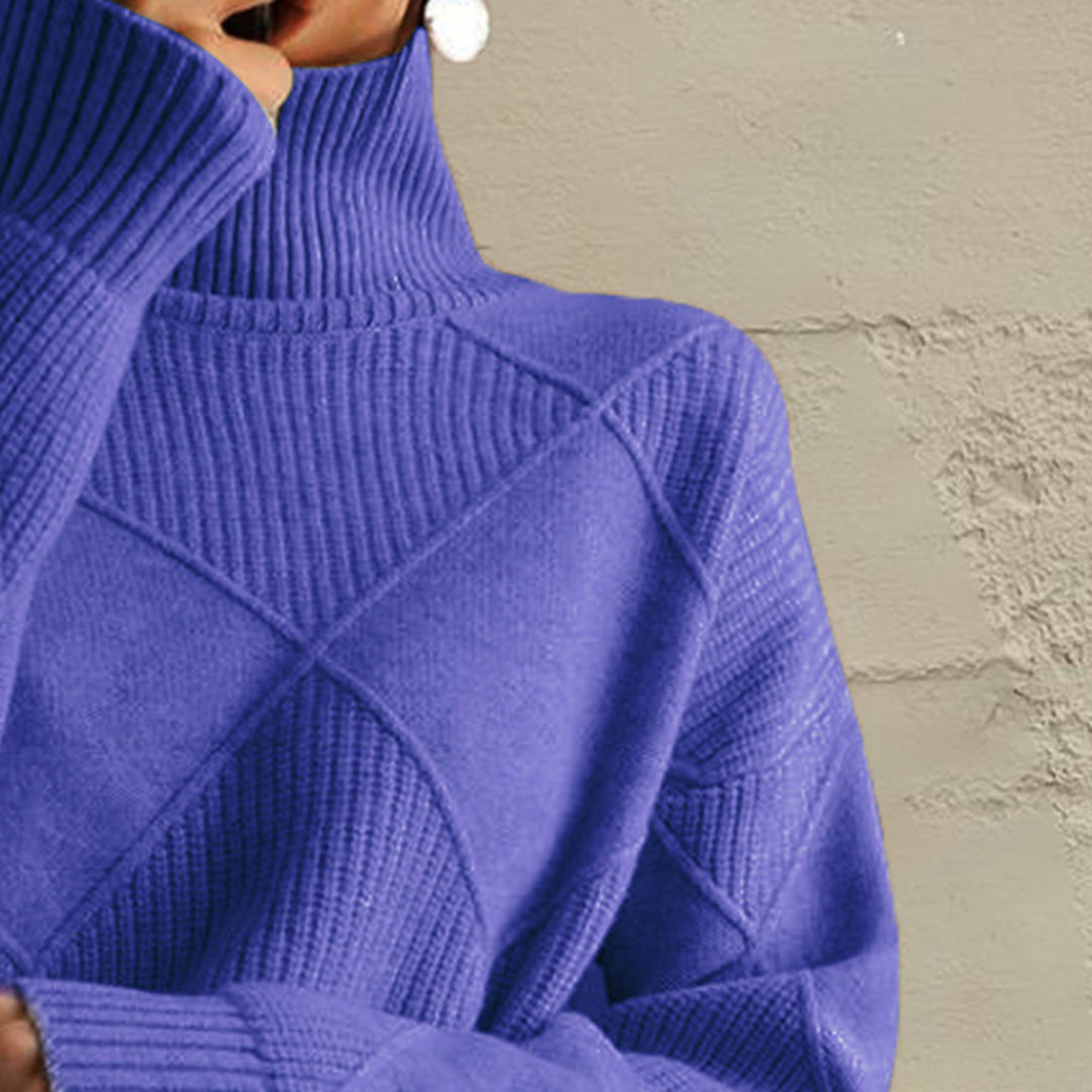Close-up of the cobalt blue turtleneck collar and diamond knit pattern