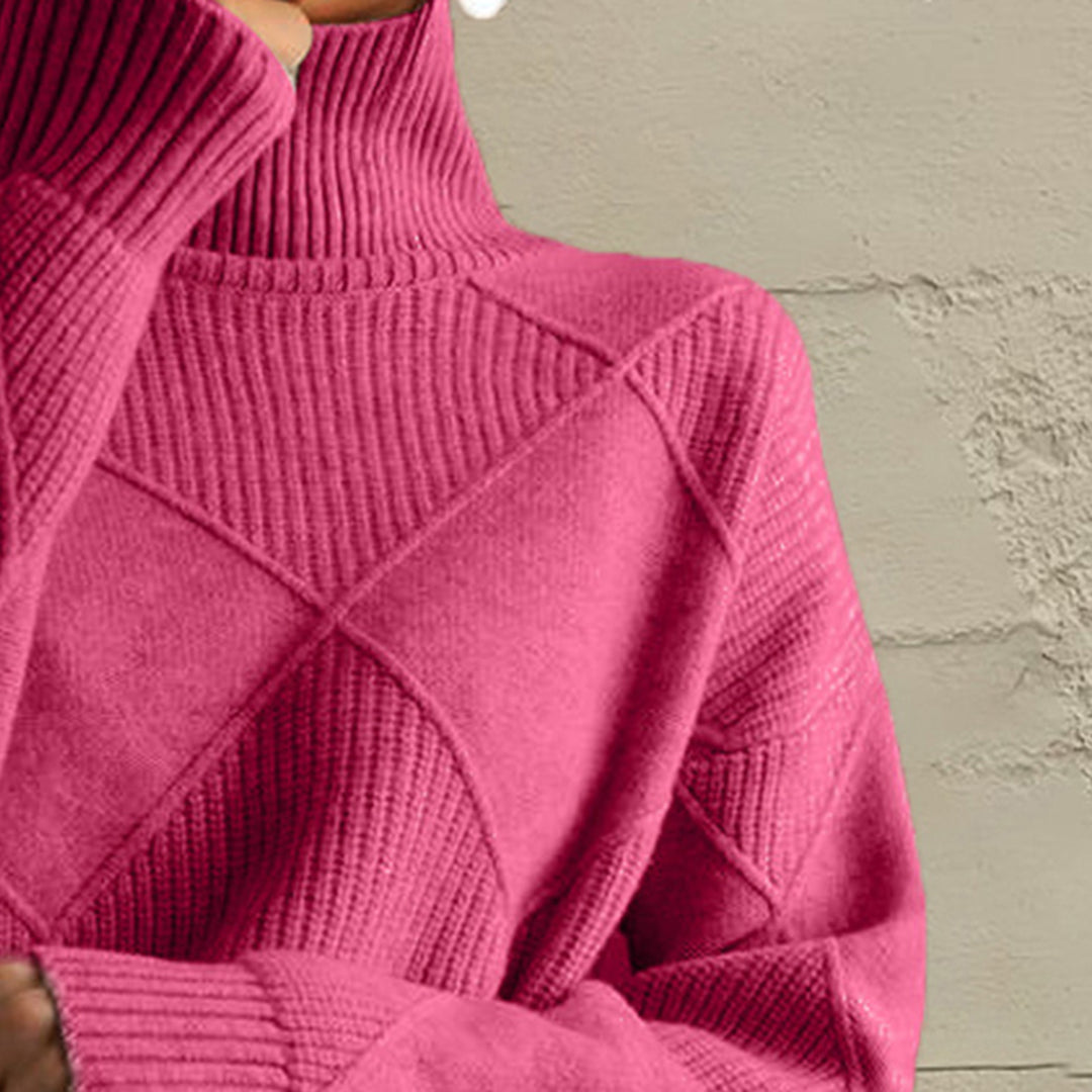 Close-up of the hot pink turtleneck collar and diamond knit pattern