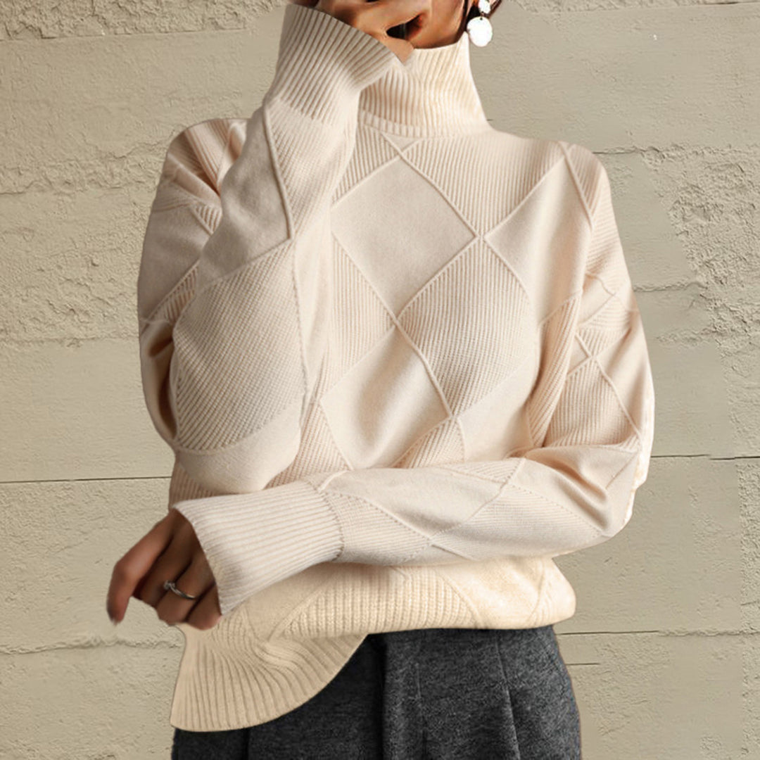 Ivory oversized turtleneck sweater with a geometric diamond knit, front view