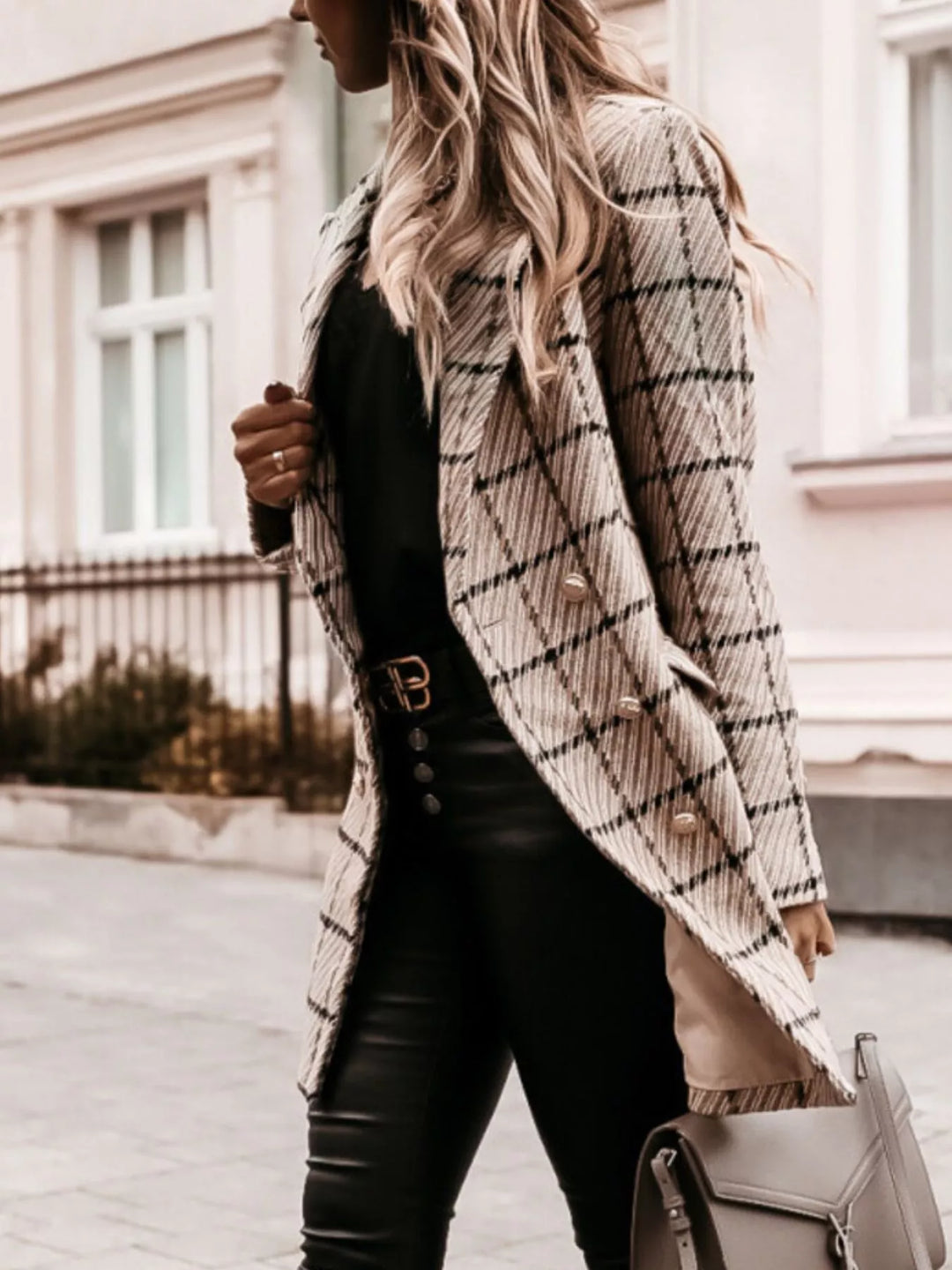 Beige plaid tweed coat styled with leather pants and a belt