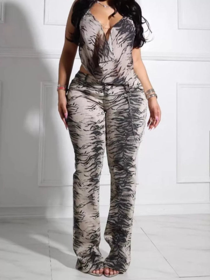 Women's two piece set with animal print halter top and flare pants, full length front view