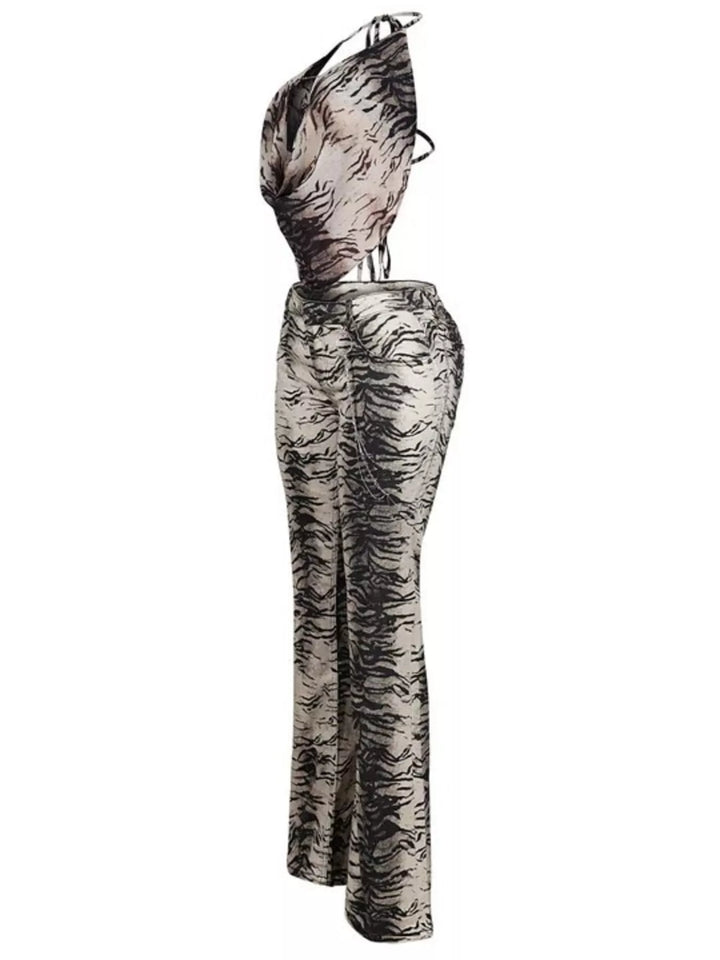 Side view of the animal print halter top and flare pants set