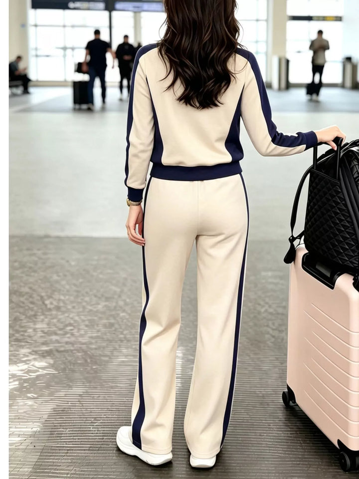 Back view of the beige crew neck top and striped pants set