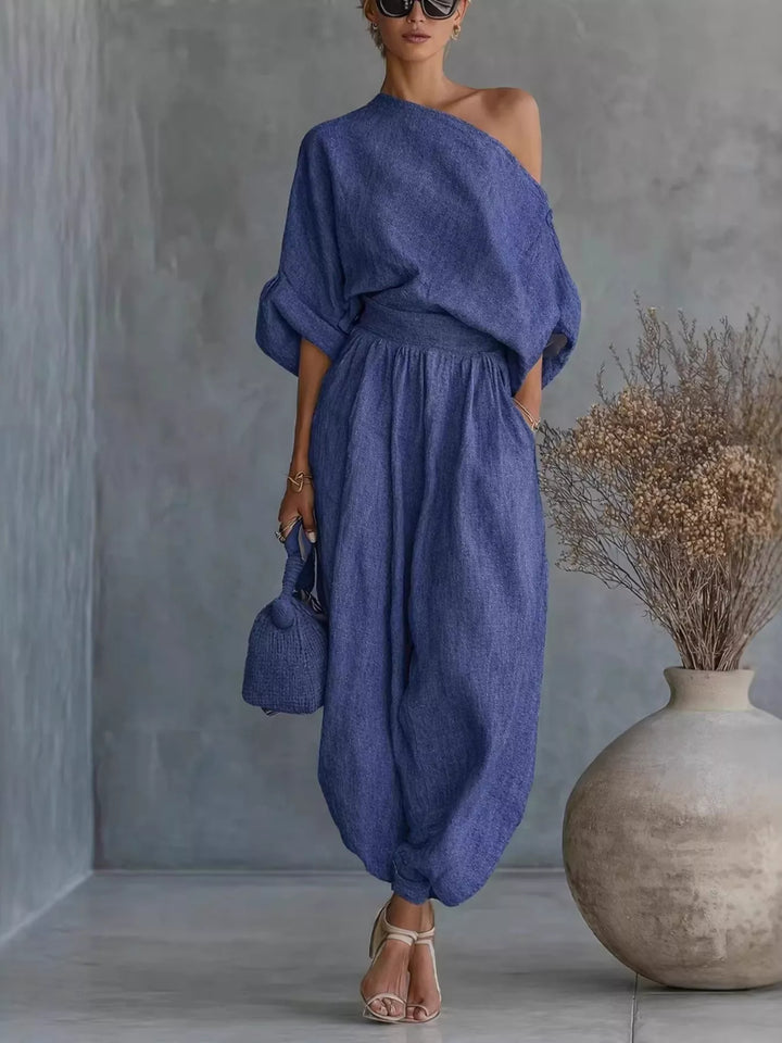 Women's two piece set in blue, one shoulder top and balloon pants, full length