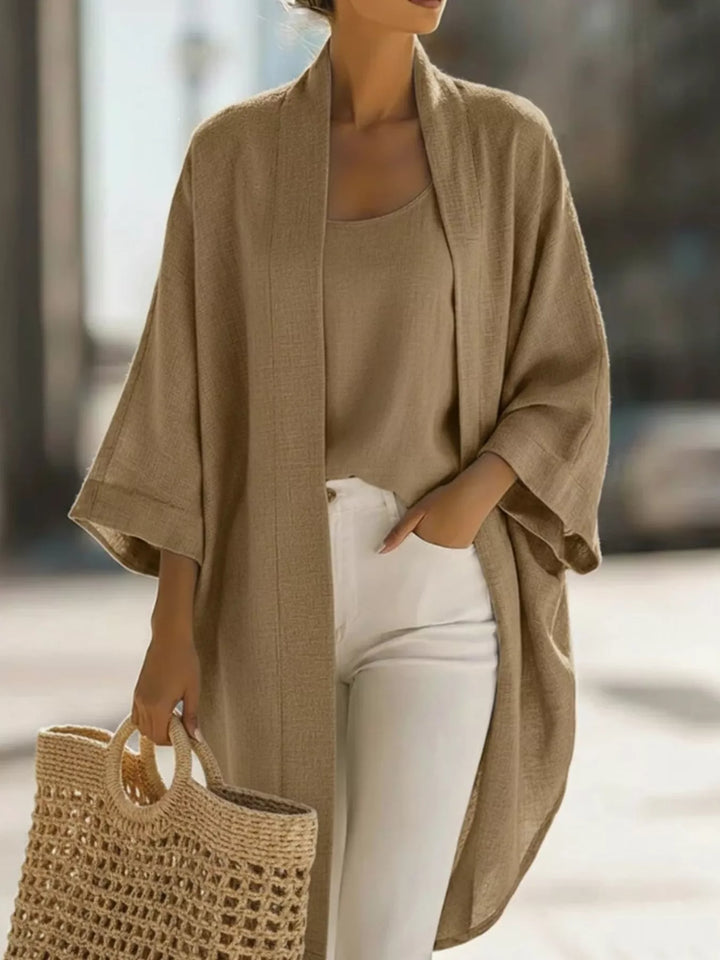 Camel open front kimono cardigan and matching tank with white pants and a straw tote